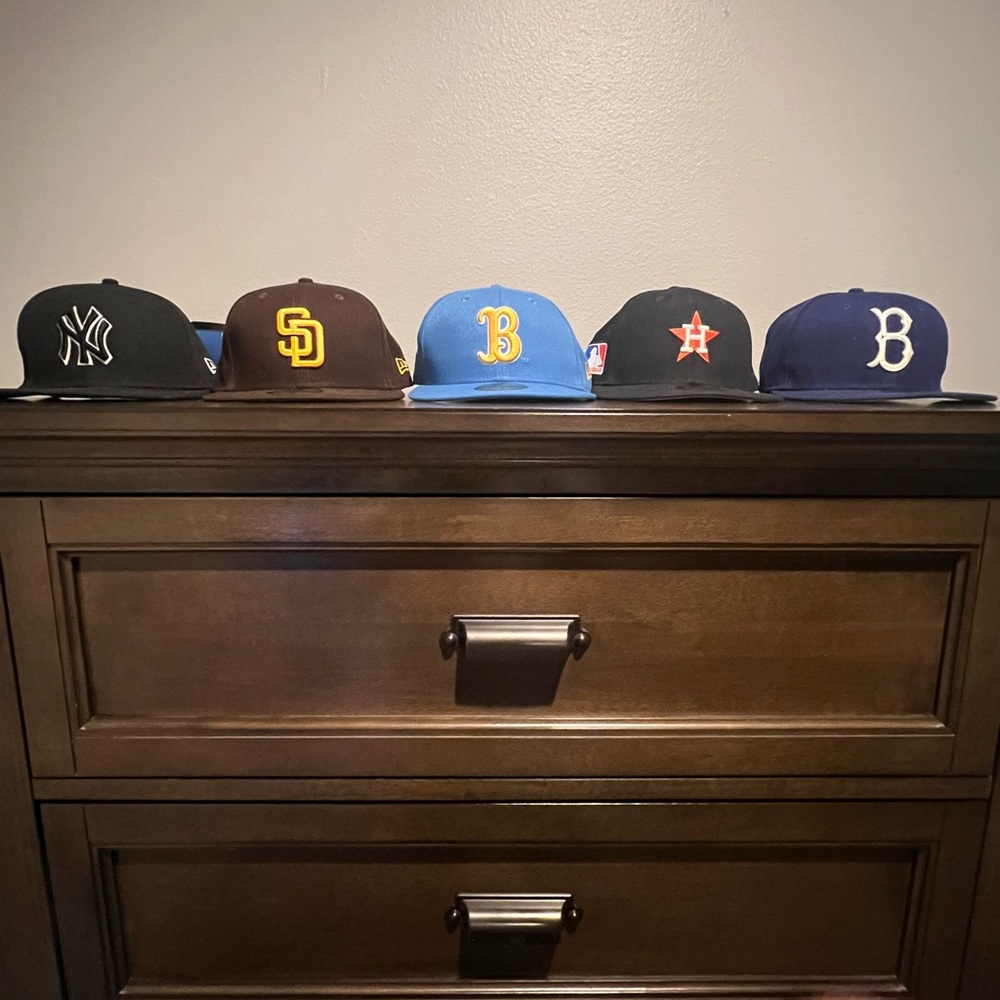 Baseball caps, all of them have been worn except the ucla one.